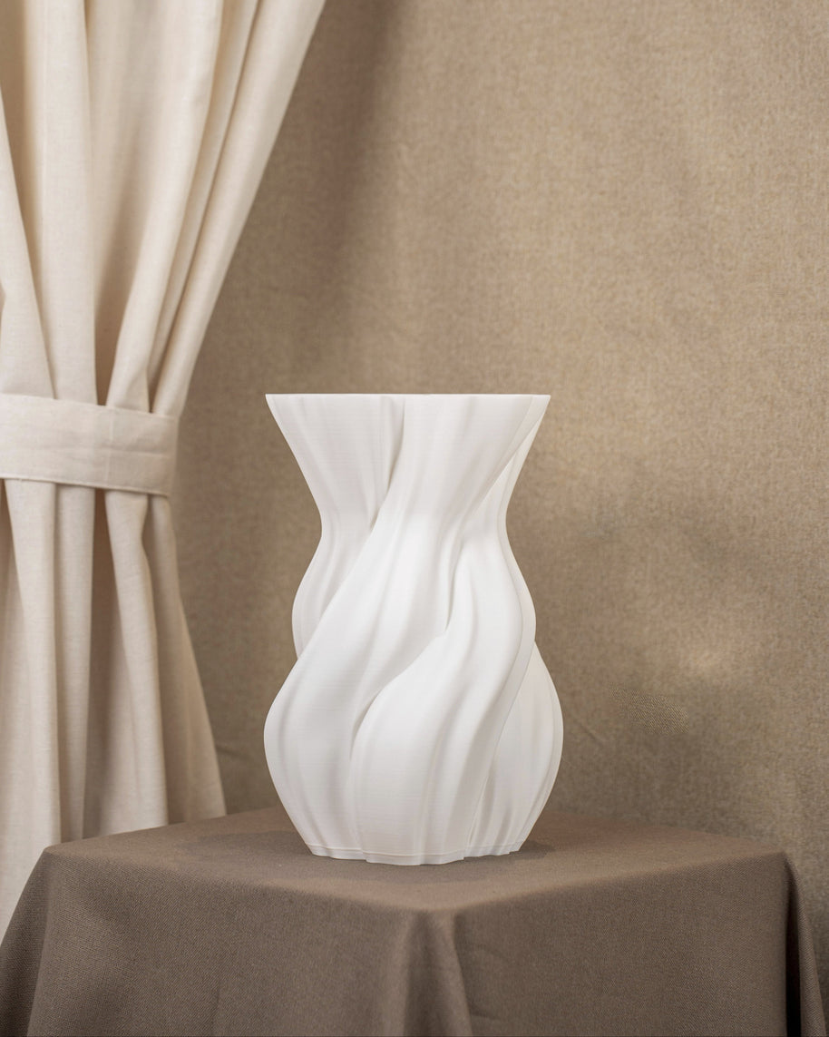Vintervad Design white sculptural vase with organic twisted tree-inspired lines made from sustainable grain materials.