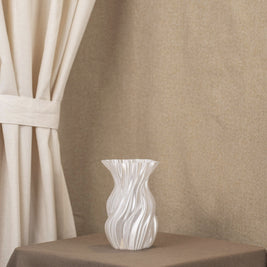 Vintervad Design Anna white sculptural vase with organic tree-inspired lines made from sustainable grain materials.