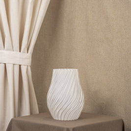 Vintervad Design Ida vase in clear, featuring a modern spiral-textured design made from sustainable corn harvest waste.