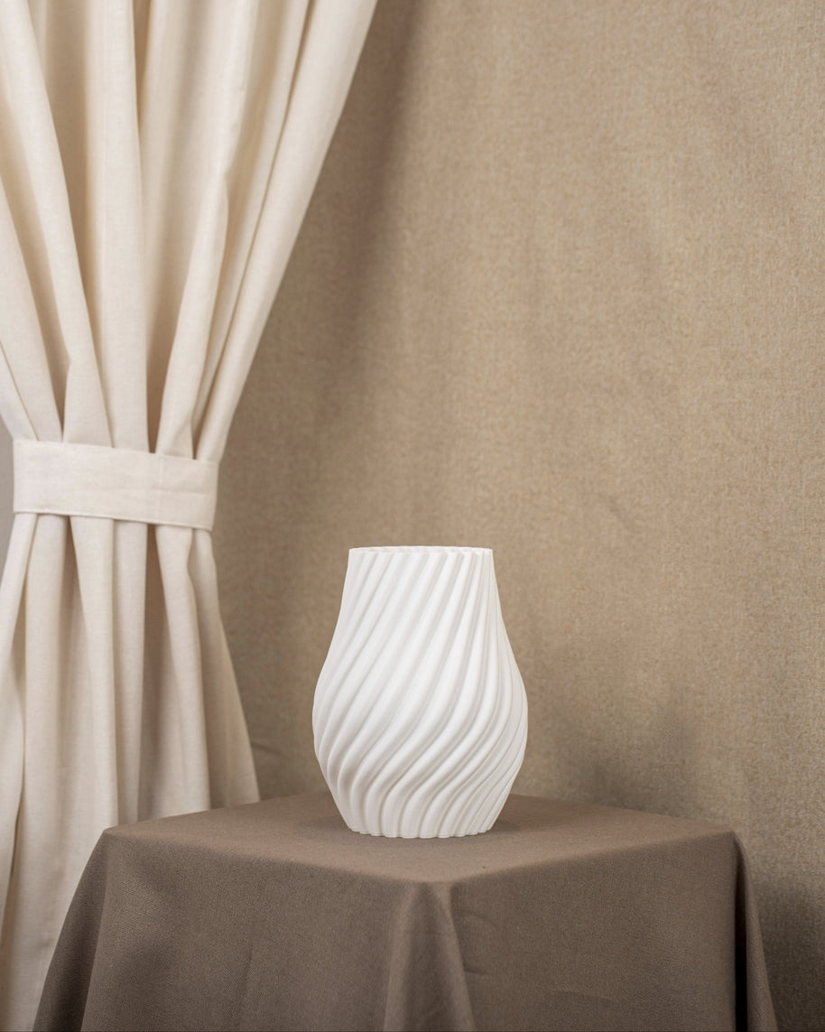 Vintervad Design Ida vase in white, featuring a modern spiral design made from sustainable, biodegradable materials.
