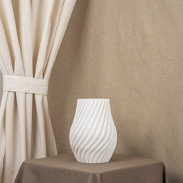 Vintervad Design Ida vase in white, featuring a modern spiral design made from sustainable, biodegradable materials.