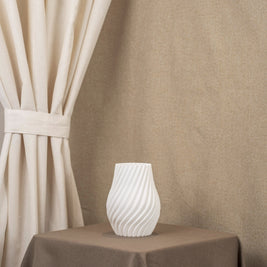 Vintervad Design Ida vase in white with a modern spiral design, made from sustainable biodegradable materials.