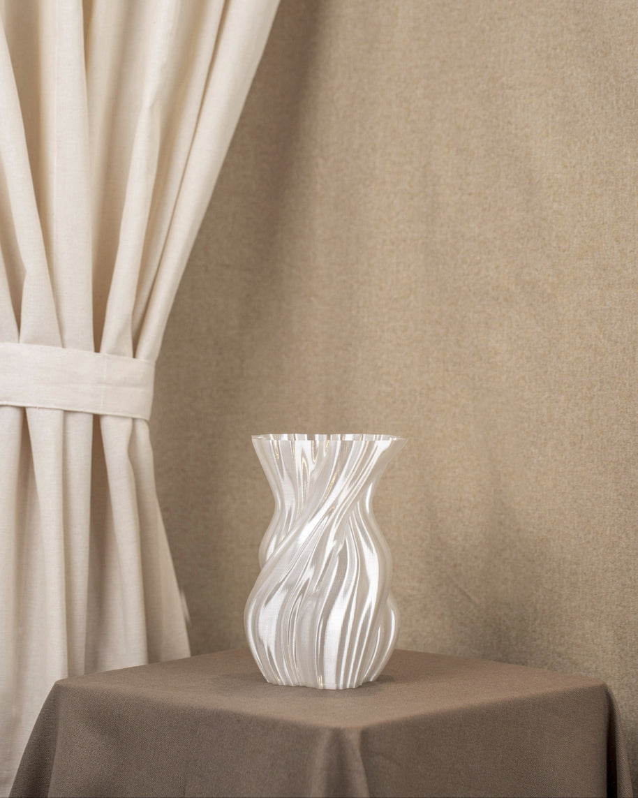 Vintervad Design Anna vase in white with a sculptural, organic twisted tree-inspired shape made from bio-materials.