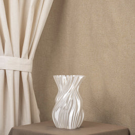 Vintervad Design Anna vase in white with a sculptural, organic twisted tree-inspired shape made from bio-materials.
